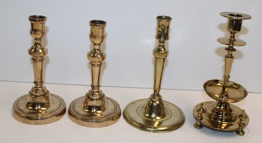 Lot of 4 antique candlesticks incl 2 bell metal, a brass baluster & a single brass - 7"-8 1/4" tall