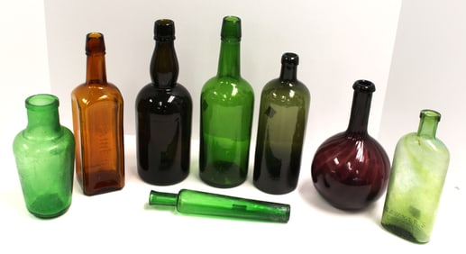 Lot of 8 vintage & antique bottles in green, amber & amethyst - 7"-11" tall