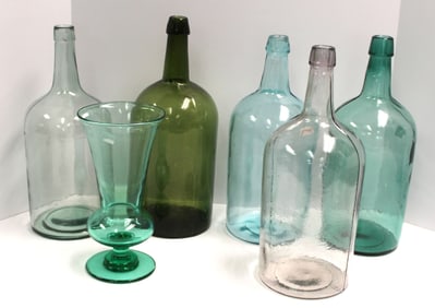 Lot of 5 large bottles in clear & aqua plus an aqua 10" vase - bottles are 14"-15" tall