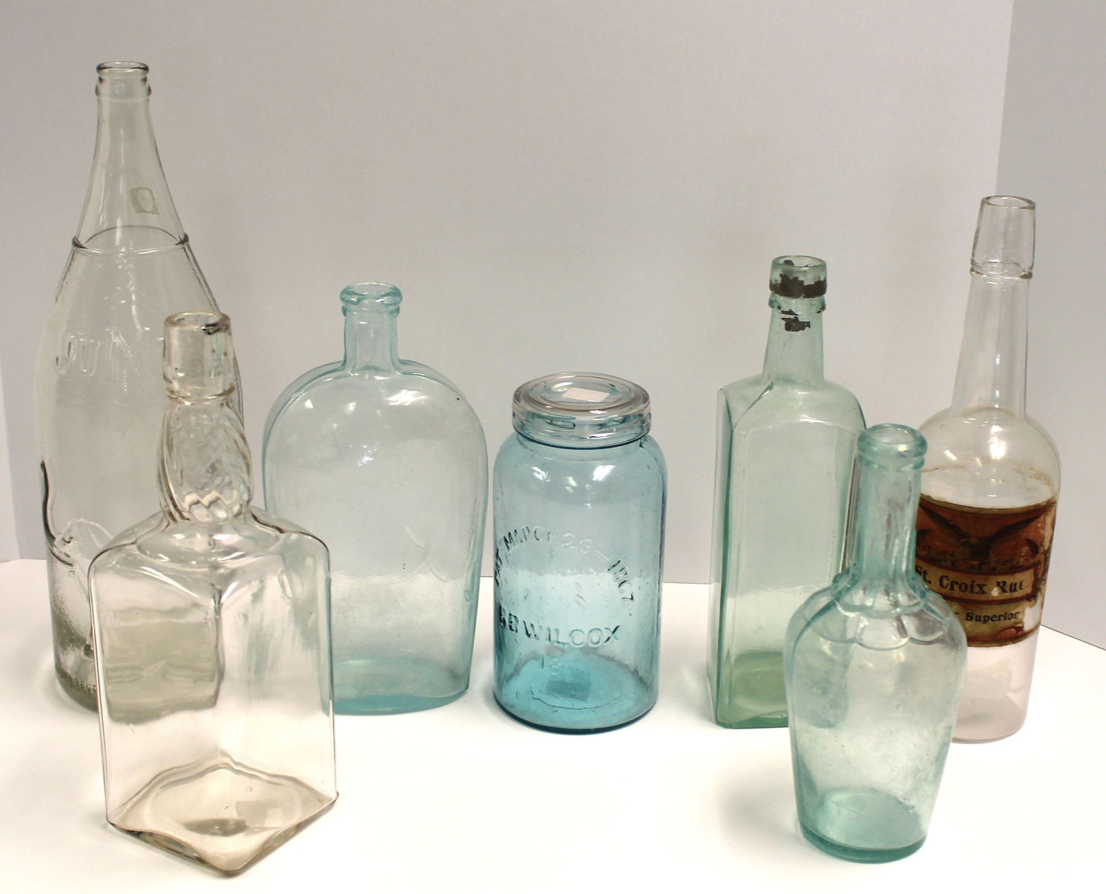 Lot of 6 bottles in clear, aqua & light blue plus a light blue glass mason jar - 7 1/2" - 14" tall (1 of 13)