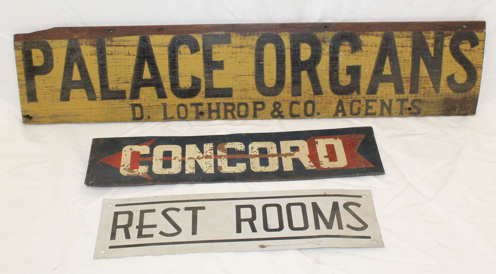 Lot of 3 vintage signs - wooden painted "Palace Organs" & 2 sheet metal "Concord" & "Restrooms" -: Lot of 3 vintage signs - wooden painted "Palace Organs" & 2 sheet metal "Concord" & "Restrooms" - 14", 16" & 27" wide