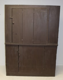 Contemporary antique style corner cupboard in brown paint with cut out back for use as an