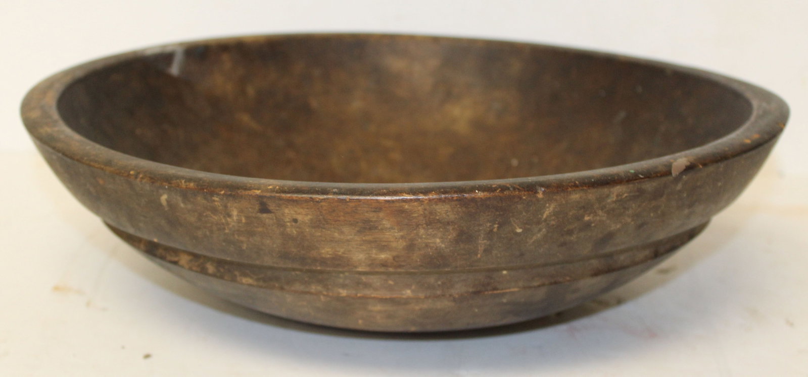 antique wooden bowl in old surface - 14 1/2" diam out of round: antique wooden bowl in old surface - 14 1/2" diam out of round