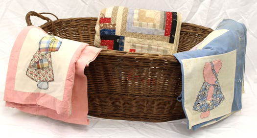 Large oval laundry basket w 3 vintage quilts