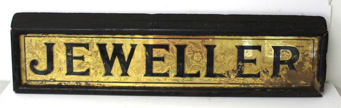 Antique reverse painted on glass sign "J.E. Weller" - as found