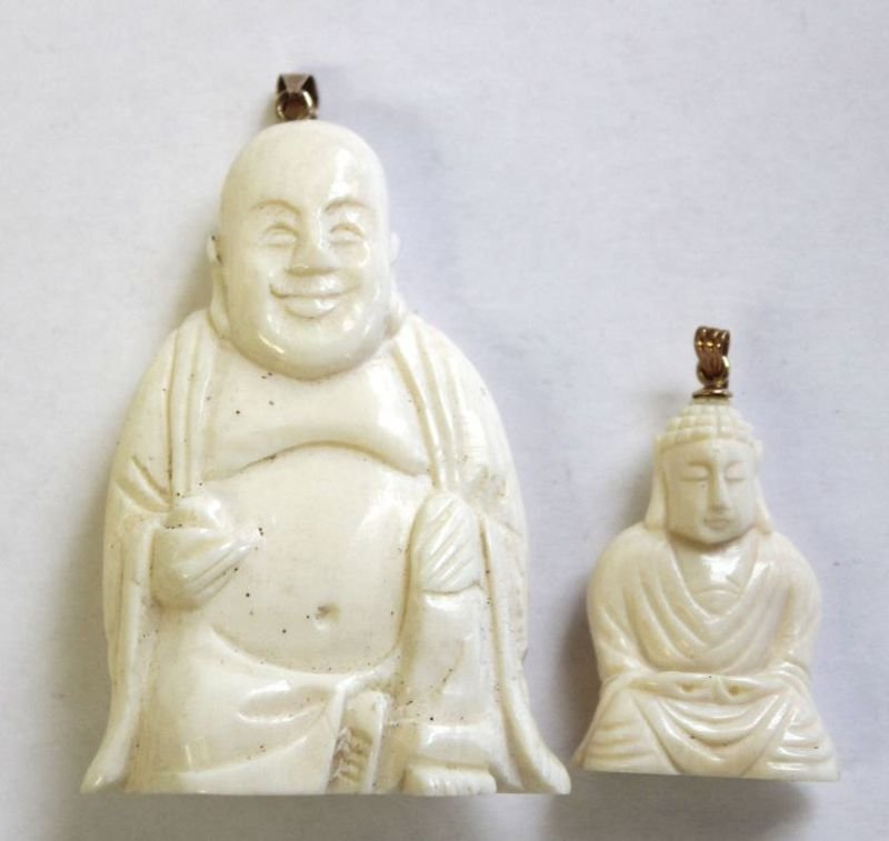 2 Chinese carved ivory Buddha pendants - 1 w 14k gold l: 2 Chinese carved ivory Buddha pendants - 1 w 14k gold loop - 2" & 1 1/4"; 2 Chinese carved ivory buddha blank chops - 1" & 3 Chinese carved buddhas in jade, ivory & carnelian - 1" - 1 1/4"