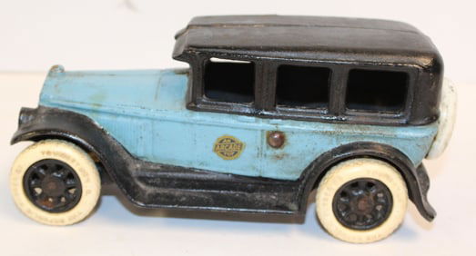 Antique Arcade cast iron sedan in blue & black w original Arcade label on one side - 8" long x 3