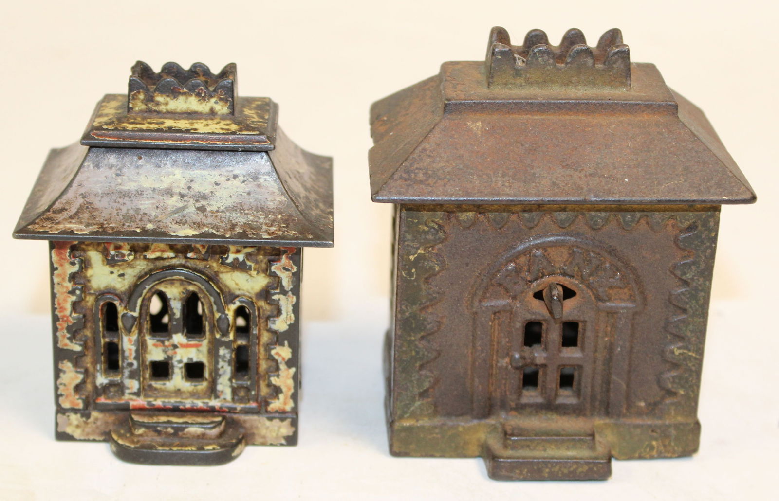 Lot of 2 antique cast iron house form still banks - 3 1/2" & 4" tall (1 of 5)