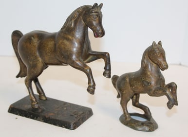 Lot of 2 antique cast iron bucking horse still banks - 7" tall x 7 1/2" long & 5 1/2" tall x 5" long