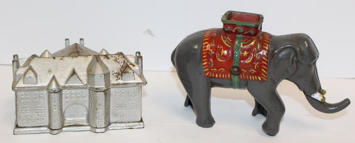 Lot of 2 antique cast iron still banks incl enameled elephant & silver painted house - 5" tall x 8"