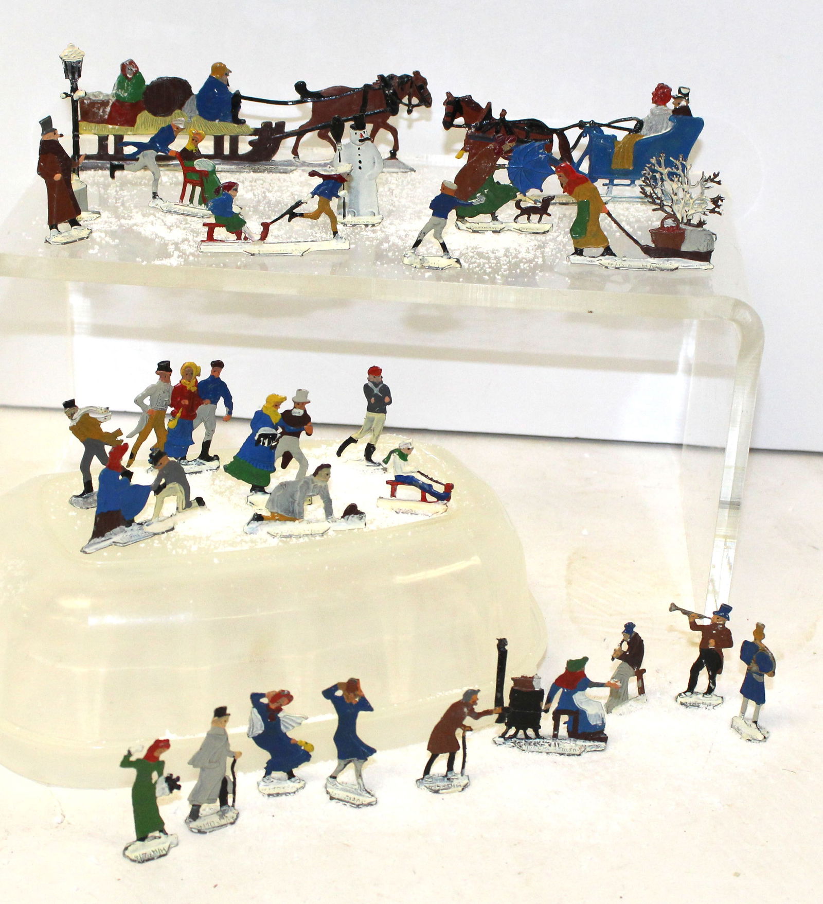 Lot of approx 30 small metal winter scene pieces incl skaters & other people, horses, sleds, (1 of 8)
