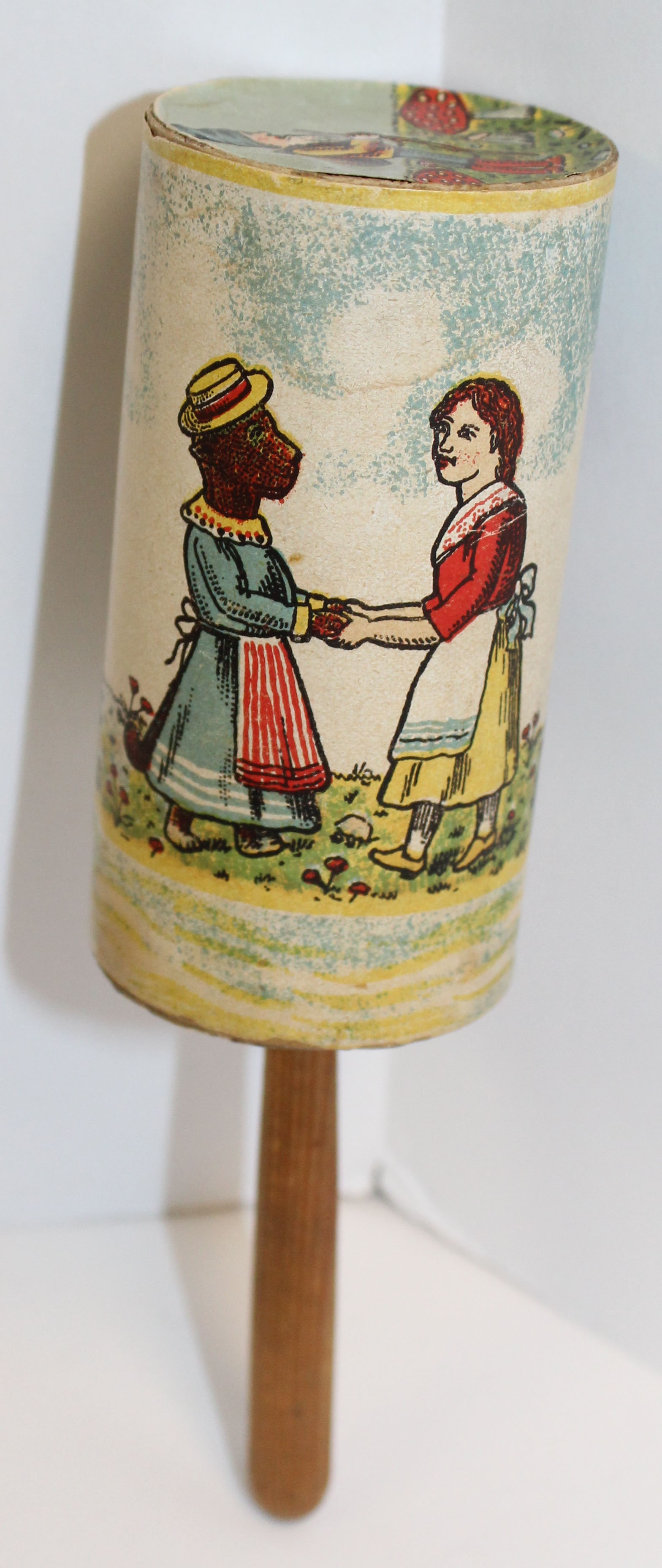 Vintage German paper rattle on wooden stick - 7": Vintage German paper rattle on wooden stick - 7"
