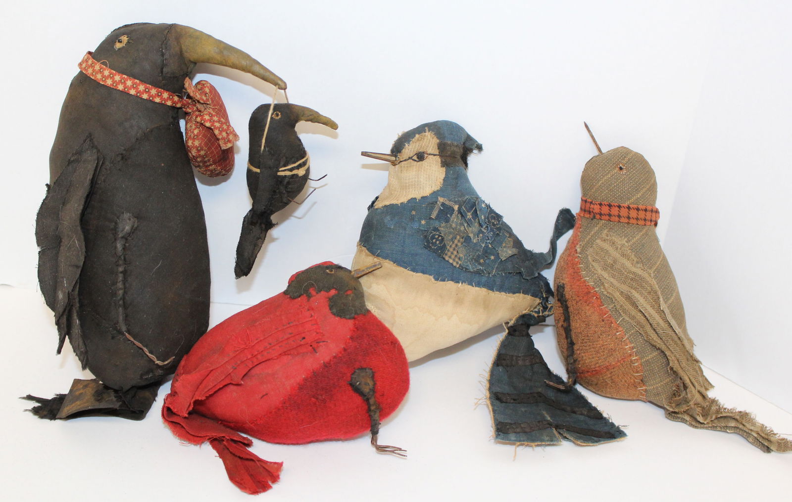Lot of stuffed fabric birds made by Angela Hillstrom- 5 1/2" - 7 1/2": Lot of stuffed fabric birds made by Angela Hillstrom, the blue jay under the tail is signed "Olde Raggs USA 2011" - 5 1/2" - 7 1/2"