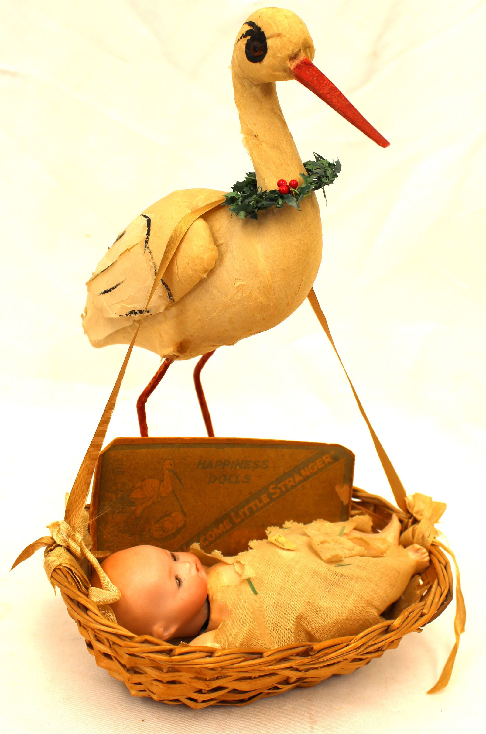 Fantastic antique German cotton stork w original baby in basket decorated with a wreath and has: Fantastic antique German cotton stork w original baby in basket decorated with a wreath and has piece of original advertising from the box - all marked Germany - 12" tall stork w 8" long basket