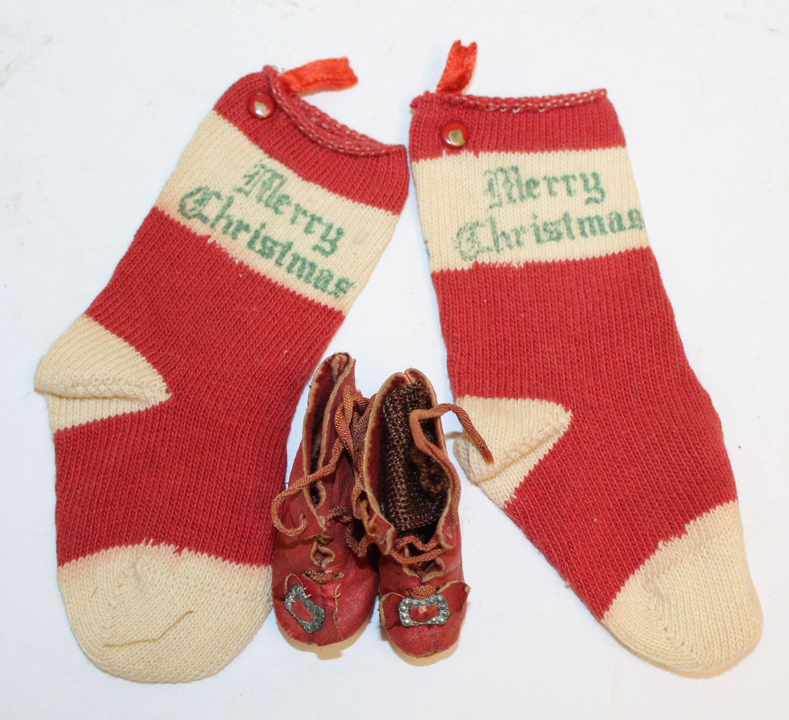 2 antique "Merry Christmas" sock ornaments together w a pair of small leather doll shoes: 2 antique "Merry Christmas" sock ornaments together w a pair of small leather doll shoes
