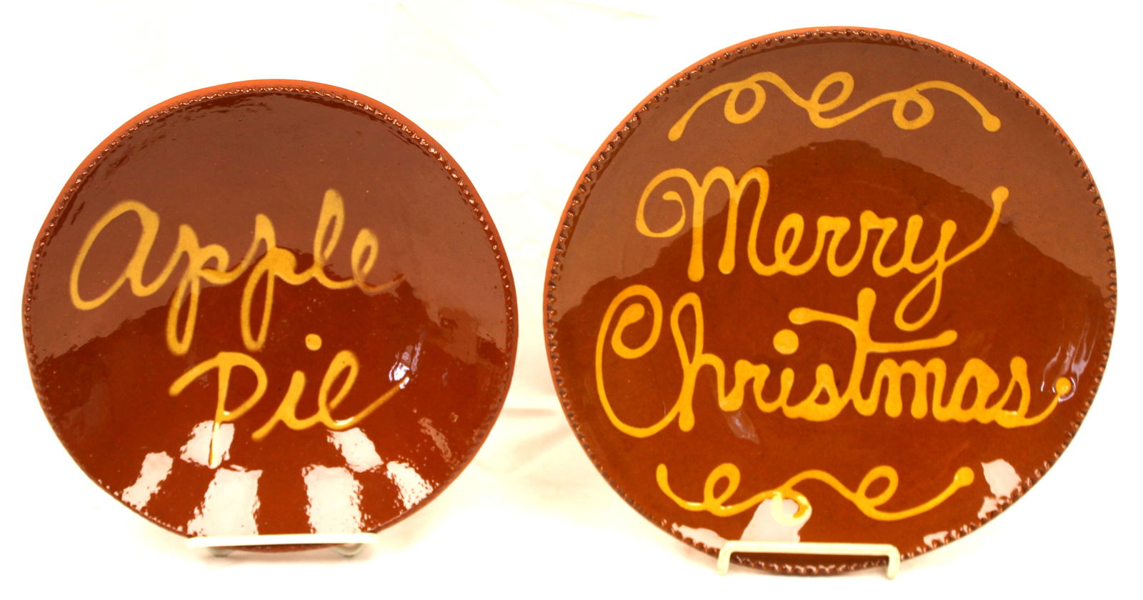 Lot of 2 Contemporary redware plates w slip decoration - "Merry Christmas" & "Apple Pie" - 10 1/2" & (1 of 9)