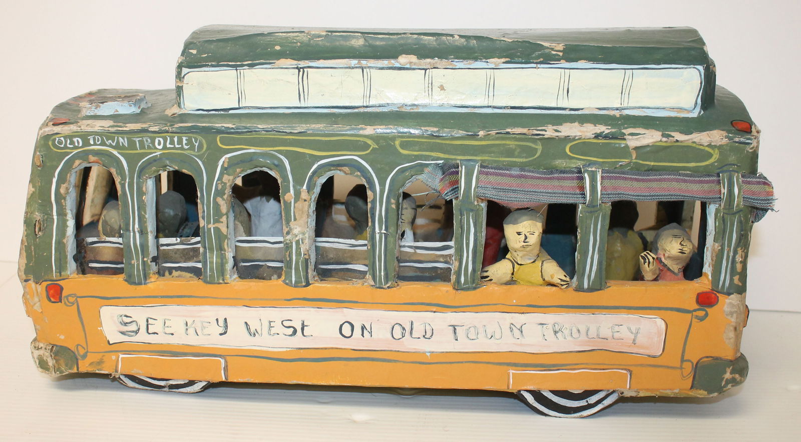 Papier mache painted Key West Trolley with passengers - 9 1/2" tall x 17" long x 6 1/2" wide: Papier mache painted Key West Trolley with passengers - 9 1/2" tall x 17" long x 6 1/2" wide