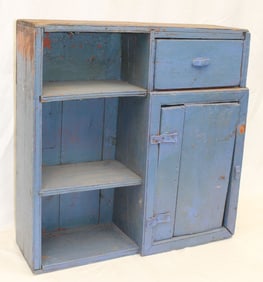 Antique small cupboard in blue paint w1 drawer over 1 door next to 3 open shelves - 26 1/2" tall x