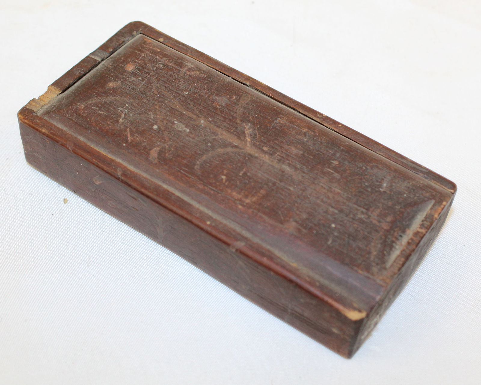 Small antique slide top box in red paint w etched dec on lid - 1"x 5 1/2"x2 1/4" (1 of 4)