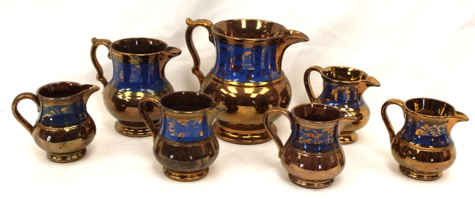 Lot of 7 blue Copper Luster pitchers/creamers - 3" - 5 1/2"