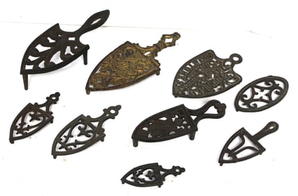 Lot of 9 antique cast iron trivets - 3"-7"