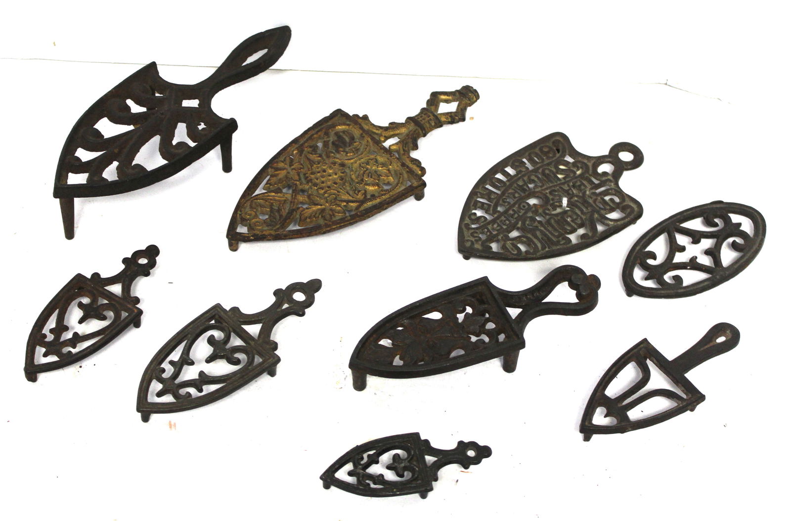 Lot of 9 antique cast iron trivets - 3"-7" (1 of 8)