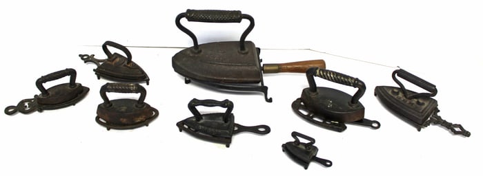 Lot of 8 antique small cast iron sad irons on trivets - 1 3/4" - 5 1/2"