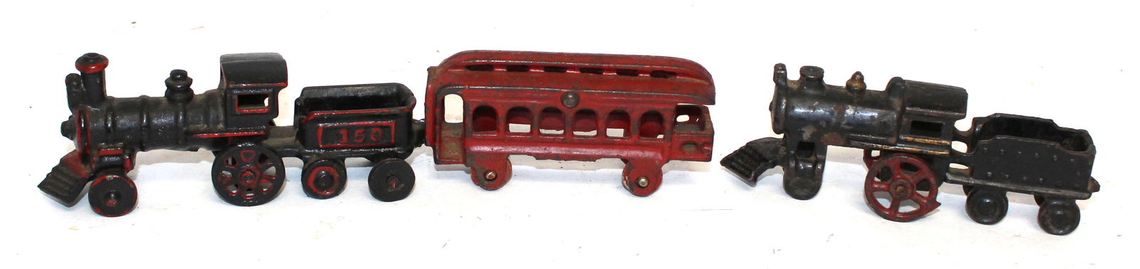 Lot of 2 antique cast iron locomotives - 1 w passenger car - approx 5" & 10" long: Lot of 2 antique cast iron locomotives - 1 w passenger car - approx 5" & 10" long