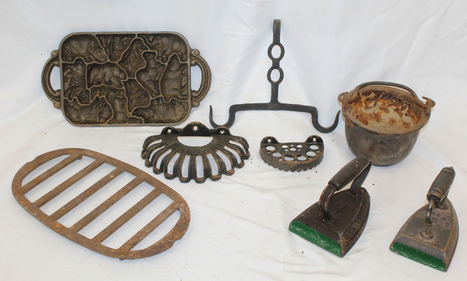 Antique cast iron lot incl trivets, pot, sad irons & mold (1 of 7)