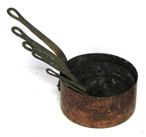 Nest of 6 antique French tin lined copper sauce pans w brass handles - smallest 2 5/8" diam &