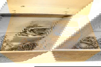 Crate filled with antique iron hooks & chain