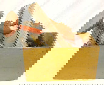 Lot of antique wooden architectural moldings/panels in a painted yellow wooden box