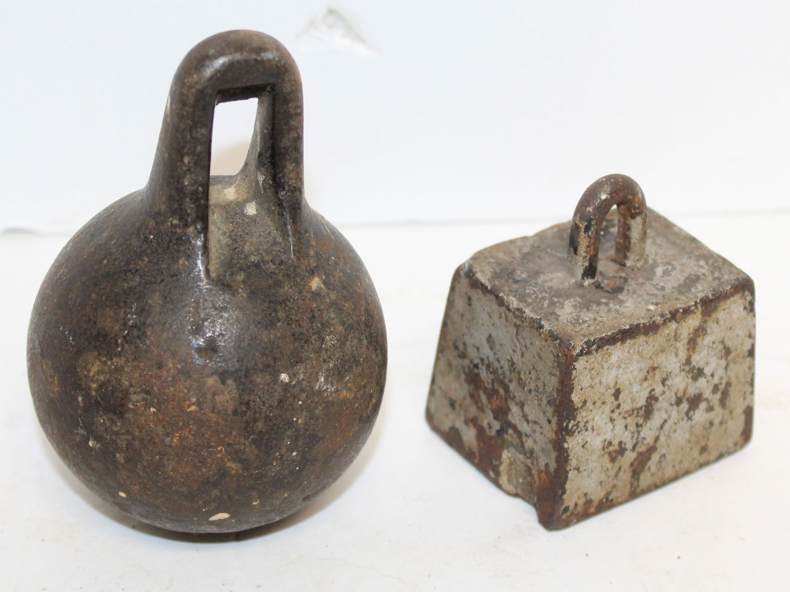 Lot of 2 antique iron weights - 4 1/2" & 2" (1 of 4)