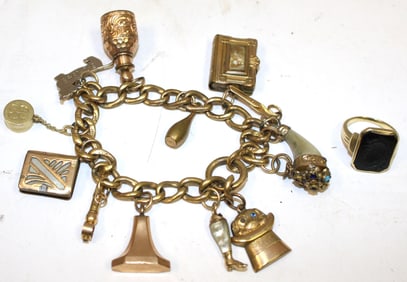 Antique jewelry lot incl 10k onyx ring plus "Aunt Dot's" gold (filled or plated) charm bracelet w