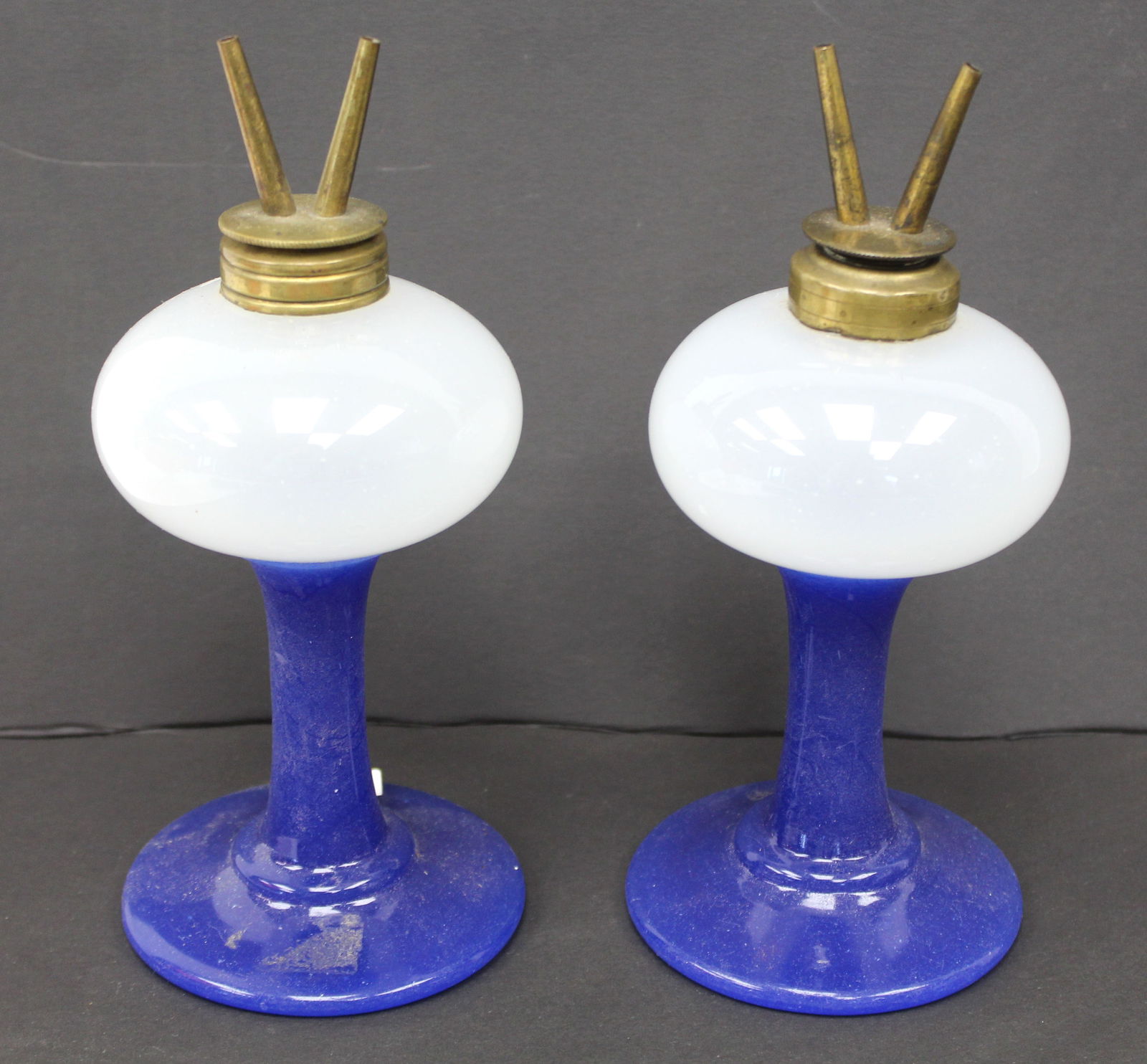 Pair of early Sandwich glass whale oil lamps w burners in opaque w cobalt bases - 8" tall to top of: Pair of early Sandwich glass whale oil lamps w burners in opaque w cobalt bases - 8" tall to top of burners