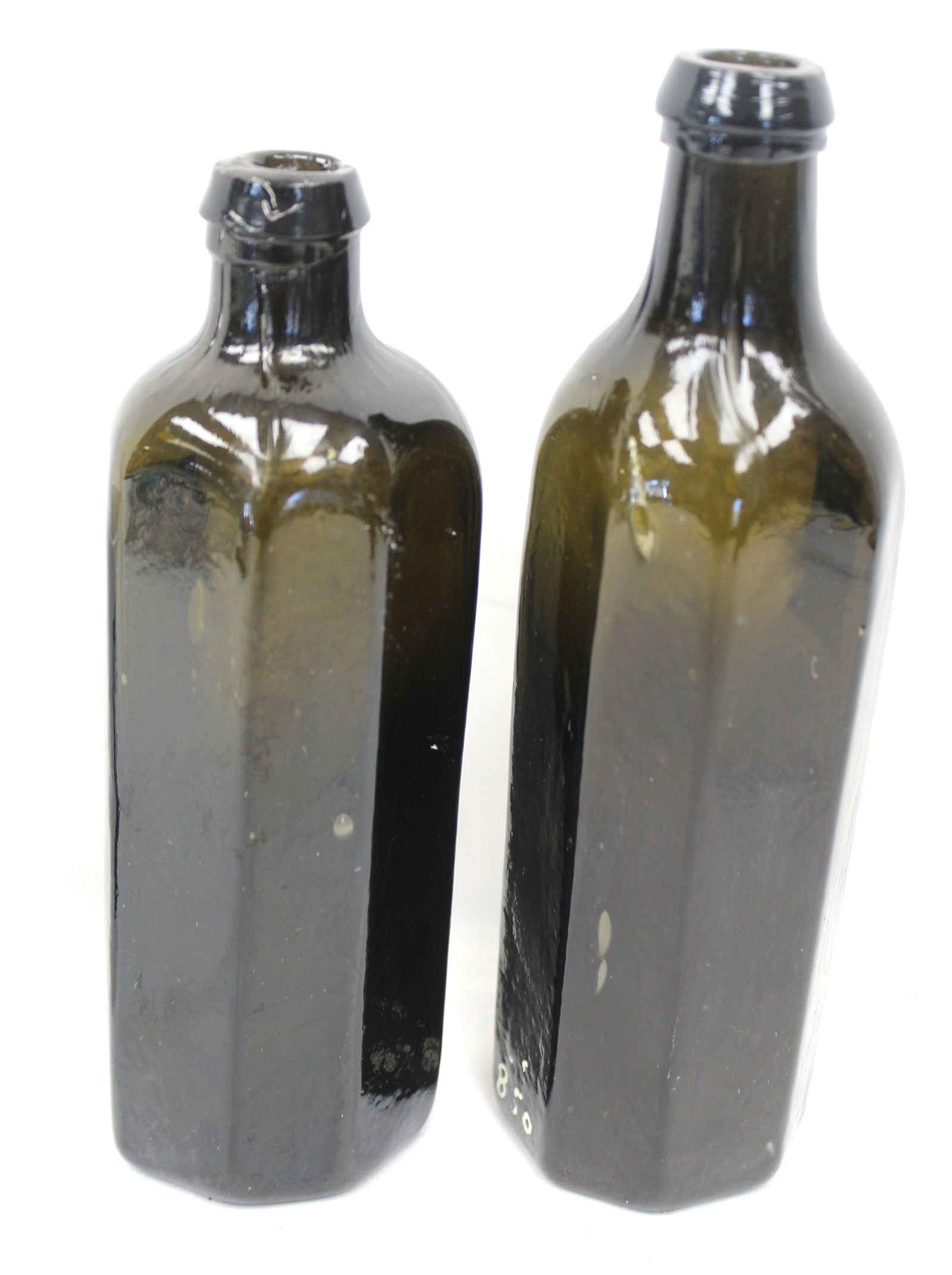 Lot of 2 early octagonal glass bottles in olive green - 6 3/4" & 7 1/2" tall: Lot of 2 early octagonal glass bottles in olive green - 6 3/4" & 7 1/2" tall