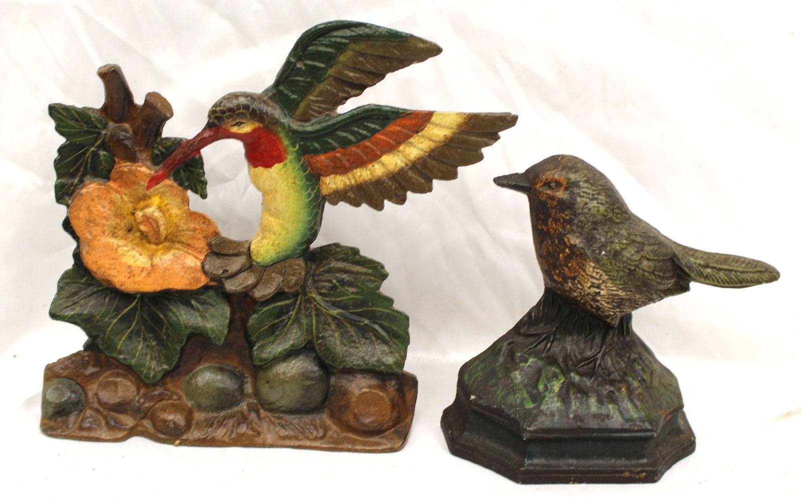 Lot of 2 antique cast iron painted doorstops - Hummingbird 8" x 9" wide & other is 6" tall (1 of 5)