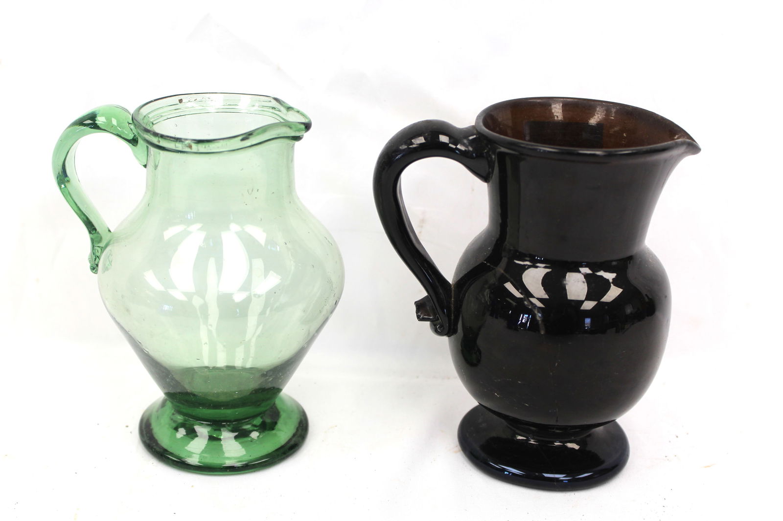 Lot of 2 early glass pitchers/creamers in green & amber - 6 1/2" & 6" tall (1 of 6)