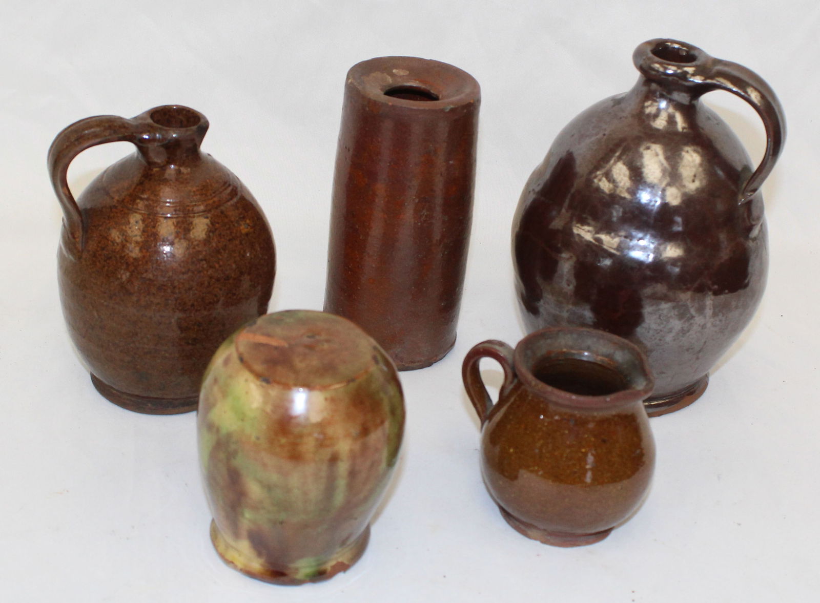 Lot of 5 antique small redware items incl w jugs, creamer, cylinder (ink?) and a bank (as found) - (1 of 9)