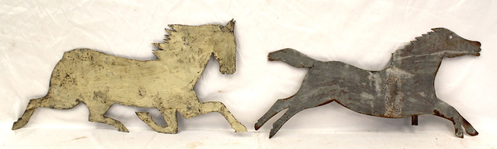 Lot of 2 sheet iron horse weathervanes incl 1 in white paint - 12" tall x 26 1/2" long & 12" tall x: Lot of 2 sheet iron horse weathervanes incl 1 in white paint - 12" tall x 26 1/2" long & 12" tall x 25" long