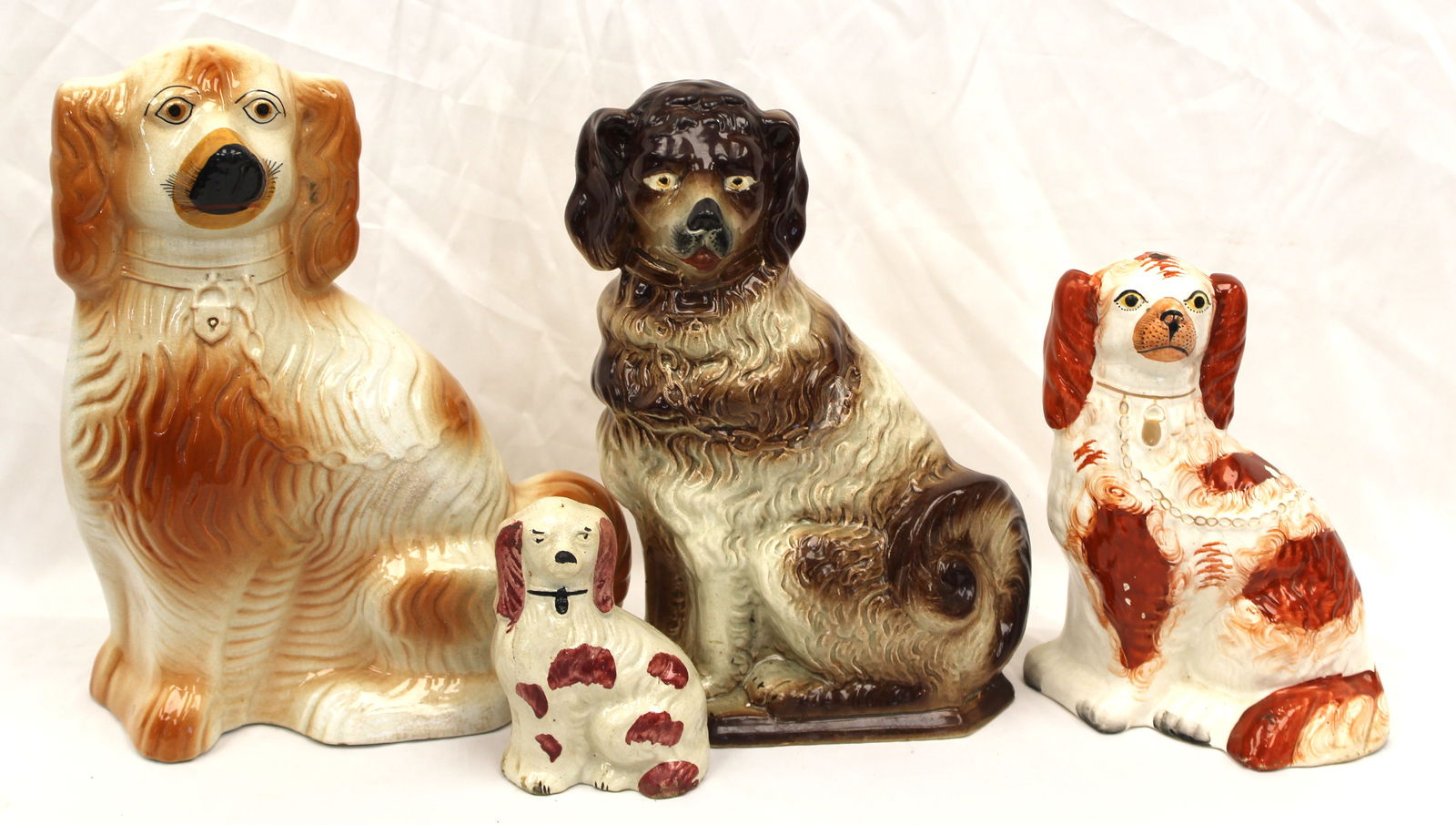 Lot of 4 antique Staffordshire Spaniels - 5 1/2" - 14" tall: Lot of 4 antique Staffordshire Spaniels - 5 1/2" - 14" tall