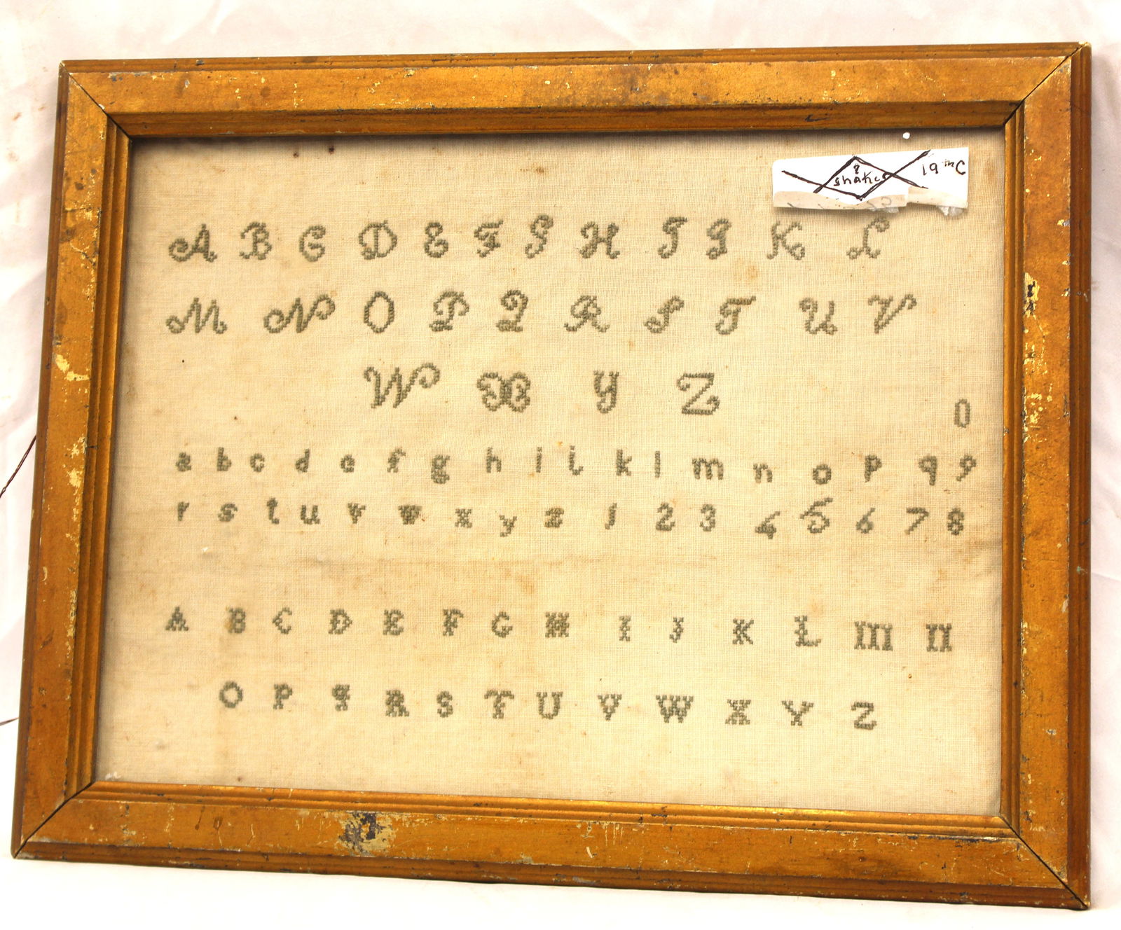 19thC alphabet sampler w note on back "A piece of ornamental needlework for practice made by Julie (1 of 6)