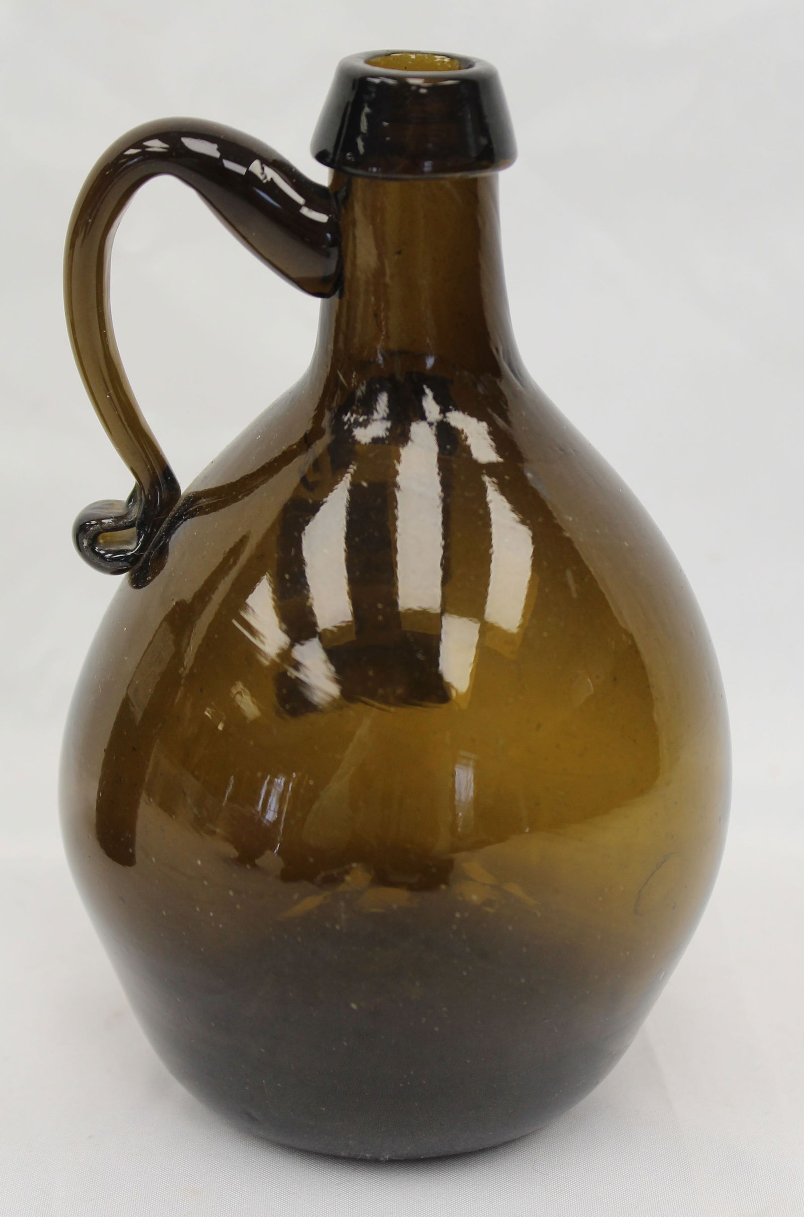 Early amber glass handled jug - 6 1/2" tall: Early amber glass handled jug - 6 1/2" tall