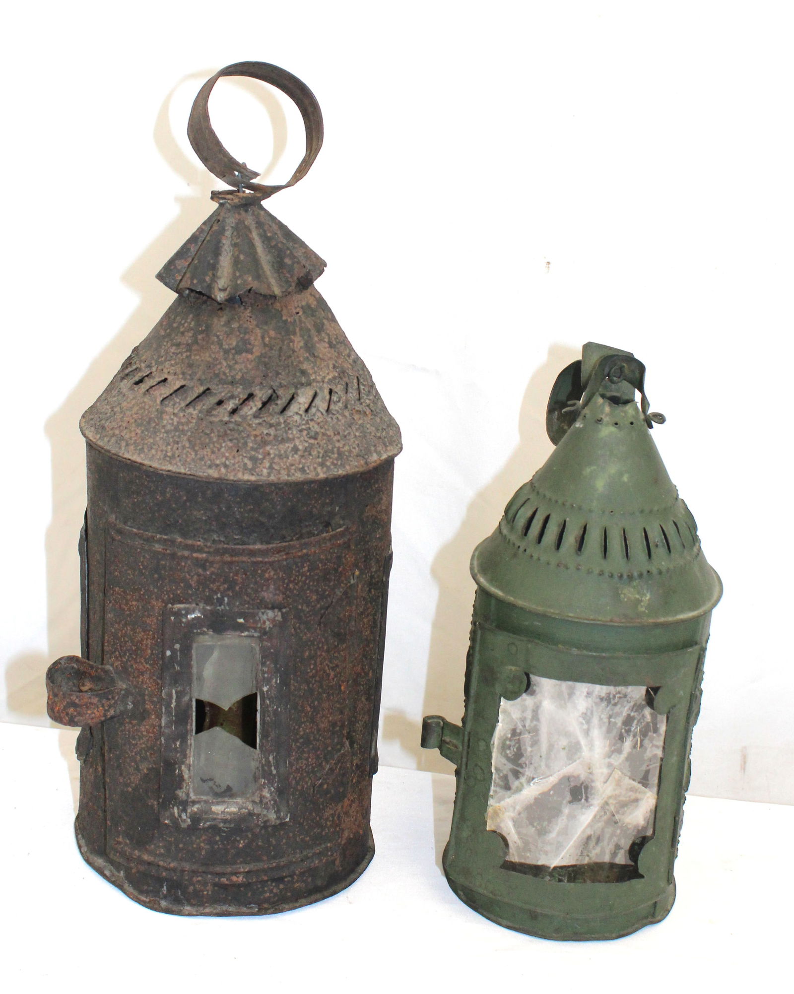 Lot of 2 antique punched tin lanterns in green & black - as found - 11" & 14 1/2" tall: Lot of 2 antique punched tin lanterns in green & black - as found - 11" & 14 1/2" tall