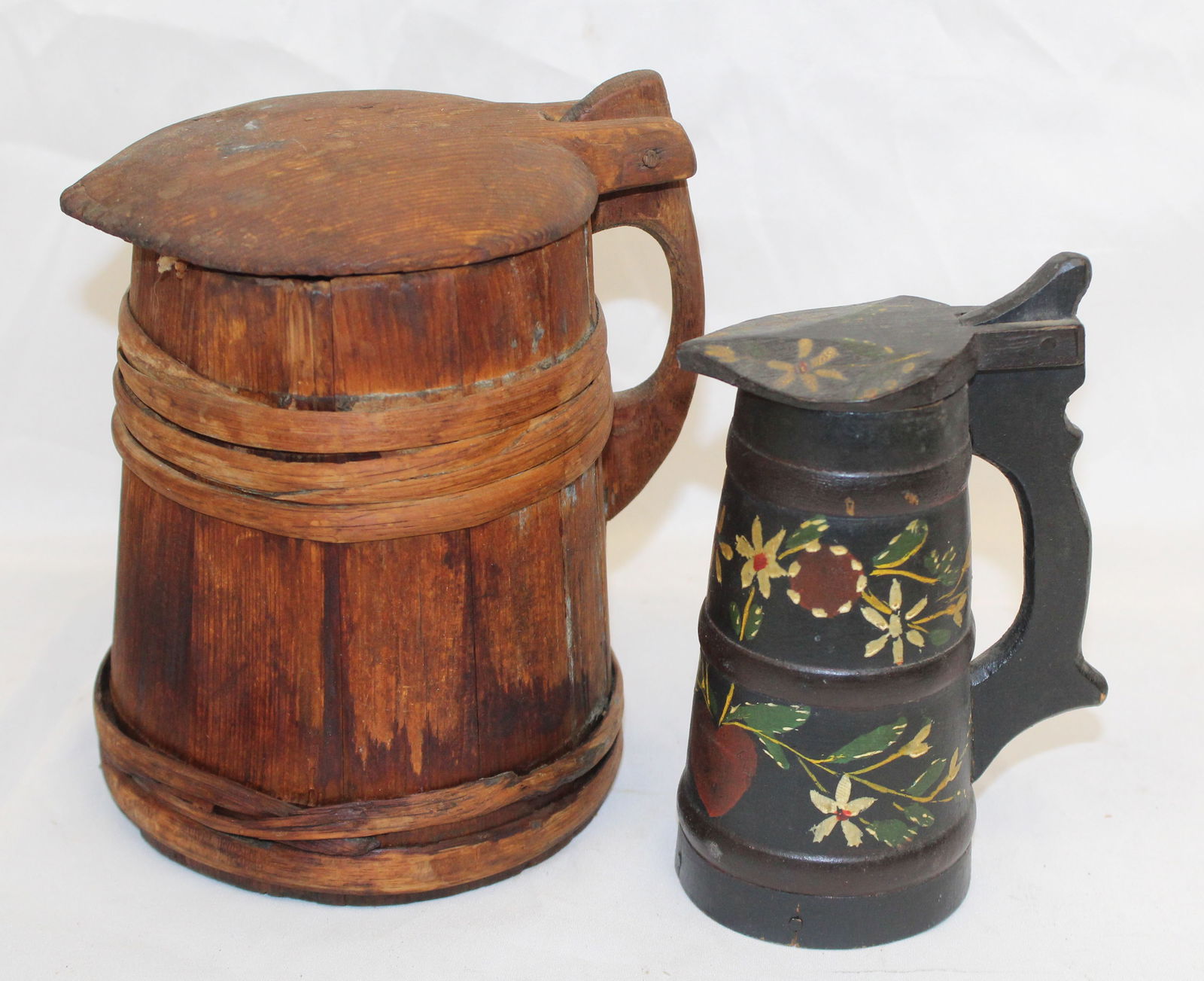 lot of 2 antique wooden tankards - 1 paint decorated - 6 1/2" & 7 1/2" tall: lot of 2 antique wooden tankards - 1 paint decorated - 6 1/2" & 7 1/2" tall