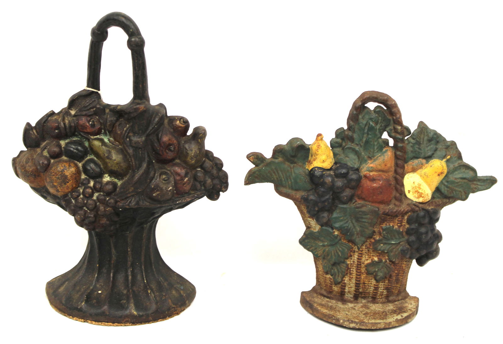 Lot of 2 cast iron painted basket of flowers doorstops - 10 1/2" & 8 1/2" tall: Lot of 2 cast iron painted basket of flowers doorstops - 10 1/2" & 8 1/2" tall