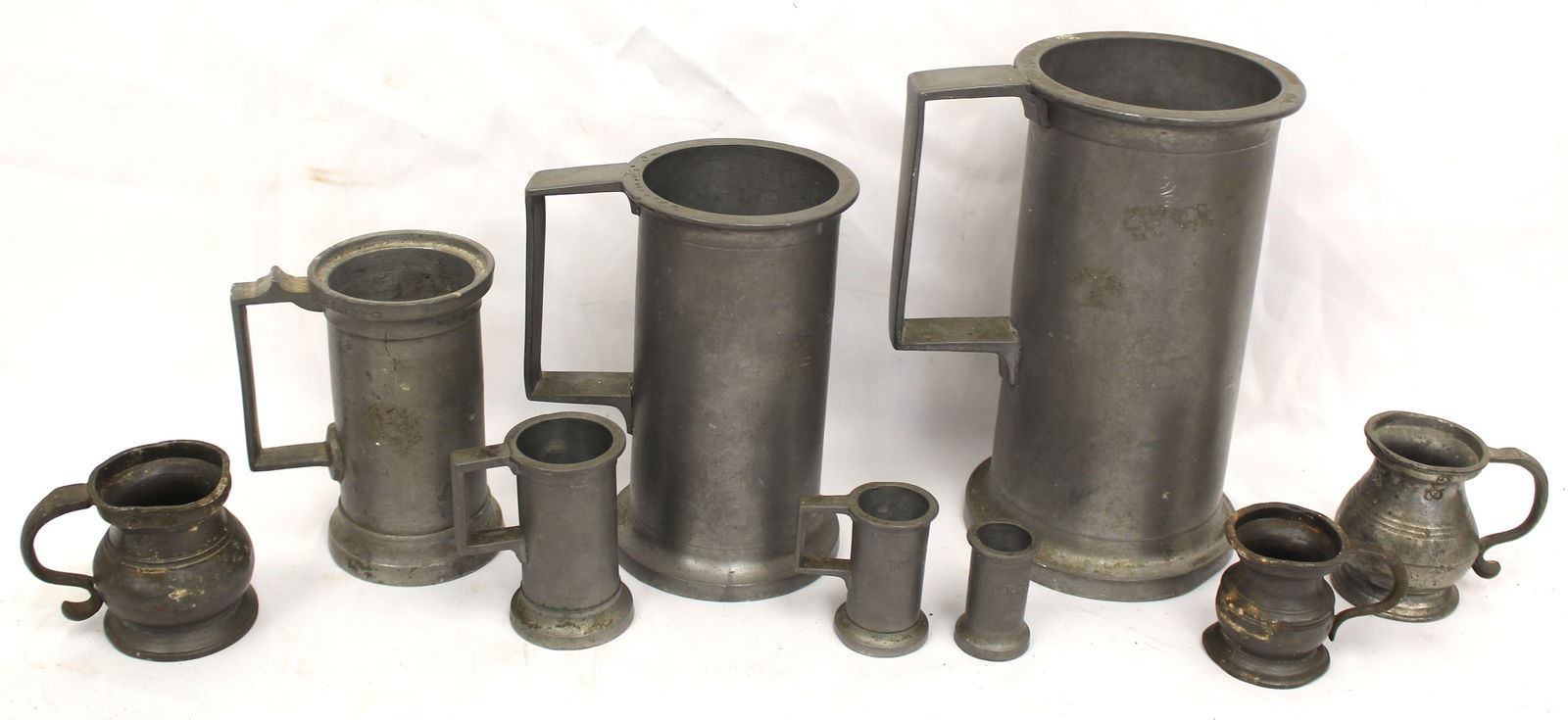 Lot of antique pewter measures - 1 1/2" - 7 1/2" tall (1 of 10)