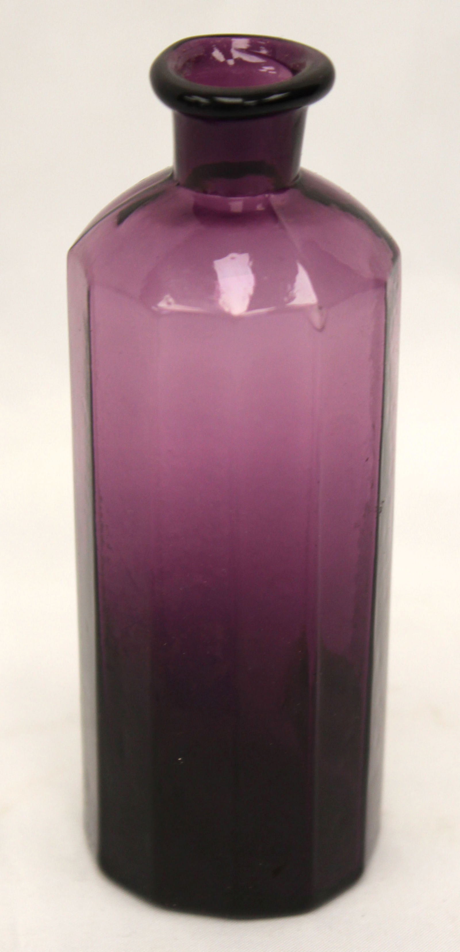 Early amethyst glass bottle 4 1/2" tall: Early amethyst glass bottle 4 1/2" tall