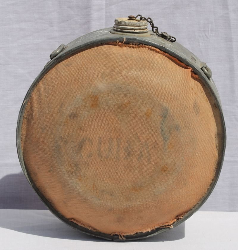 signed "Cuba" galvanized metal canteen w canvas over: signed "Cuba" galvanized metal canteen w canvas over surface - found in Punta Gorda - which was a staging grounds for SAW Troops headed to Cuba - 9" diam