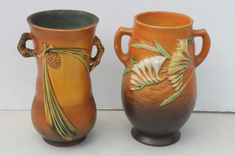lot of two Roseville 7 1/2" 2 handled vases in Freesia: lot of two Roseville 7 1/2" 2 handled vases in Freesia & Pinecone patterns